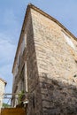 The corner of an old stone house. High building view from below. Old Town of Budva. Montenegro Royalty Free Stock Photo