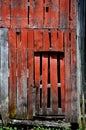 Corner of Red Weathered Barn and Door Royalty Free Stock Photo