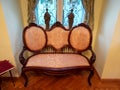 A corner in a room in the Iulia Hasdeu palace with a orange couch