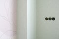 a corner of a room with light walls. new sockets are located on one part of the wall Royalty Free Stock Photo