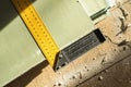 Corner ruler on drywall sheets. The stack of gypsum board preparing for construction