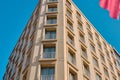 Corner shape of modern architecture building and many windows behind the a part of turkish flag Royalty Free Stock Photo