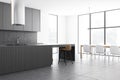 Gray kitchen corner with bar and dining table Royalty Free Stock Photo