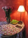 Corner table with flowers and lamp light