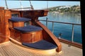 A corner with three step seat on the deck of the wooden classical luxury gulet.