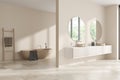 Corner view on bright bathroom interior with bathtub, double sink Royalty Free Stock Photo