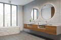 Corner view on bright bathroom interior with bathtub, panoramic window Royalty Free Stock Photo