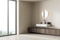 Corner view on bright bathroom interior with panoramic window Royalty Free Stock Photo