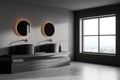 Corner view on dark bathroom interior with window and mirrors Royalty Free Stock Photo