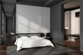 Corner view on dark bedroom interior with empty concrete wall Royalty Free Stock Photo