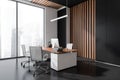 Corner view of elegant dark grey office