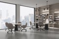 Modern office interior with work desk and meeting table, panoramic window Royalty Free Stock Photo