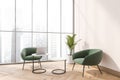 Corner view of panoramic beige and green office seating area Royalty Free Stock Photo