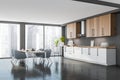 Corner view of panoramic wooden half white kitchen, blue chairs Royalty Free Stock Photo