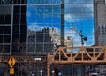 Corner of Wacker Drive and Lake Street in Chicago Loop, with Merchandise Mart reflected in a mirrored building exterior, and Photo