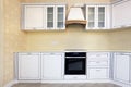 Corner white kitchen and yellow, beige walls. Royalty Free Stock Photo