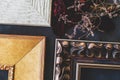 Corners of empty ornamental vintage picture art frames on dark canvas backdrop. Royalty Free Stock Photo