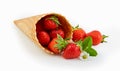 Cornet wafer ice cream cone with ripe strawberries
