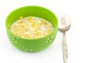 Cornflake cereals in a bowl with spoon on white background, quick breakfast Royalty Free Stock Photo