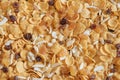 Cornflakes background with almond and raisin.