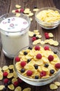 Cornflakes with berries and cup of milk Royalty Free Stock Photo