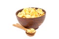 Cornflakes in bowl and wooden spoon. Royalty Free Stock Photo