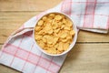 Cornflakes breakfast in bowl kitchen cloth wooden background for cereal healthy food