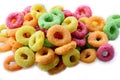 Cornflakes breakfast cereal rings with fruits on a white macro background Royalty Free Stock Photo