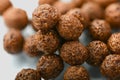 Cornflakes breakfast cereal spherical chocolate on a white background close Macro