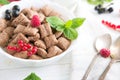 Cornflakes and different Berries Healthy tasty breakfast chocolate square pads with strawberries, raspberries, black Royalty Free Stock Photo