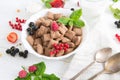 Cornflakes and different Berries Healthy tasty breakfast chocolate square pads with strawberries, raspberries, black Royalty Free Stock Photo