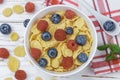 Cornflakes with fresh berries raspberry and blueberry Royalty Free Stock Photo