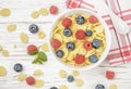 Cornflakes with fresh berries raspberry and blueberry Royalty Free Stock Photo