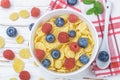 Cornflakes with fresh berries raspberry and blueberry Royalty Free Stock Photo