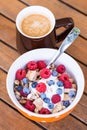 Cornflakes with fresh fruits, yogurt and coffee Royalty Free Stock Photo