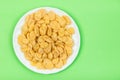 Cornflakes isolated close up on green Royalty Free Stock Photo