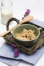 Cornflakes and a jar of milk served in a basket