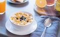 Cornflakes with milk and berries on wooden table. Healthy breakfast concept Royalty Free Stock Photo