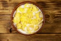 Cornflakes with milk in a bowl on wooden table. Top view Royalty Free Stock Photo