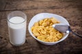 Cornflakes with milk on old wooden table Royalty Free Stock Photo