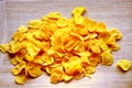 Cornflakes on wood cutboard Royalty Free Stock Photo