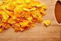 Cornflakes on wood cutboard Royalty Free Stock Photo
