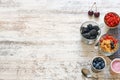 Cornflakes, yogurt and berries on a wooden table. Royalty Free Stock Photo