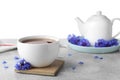 Cornflower tea and flowers on grey table