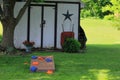 Cornhole board and bags ready for a game in a typical American backyard Royalty Free Stock Photo