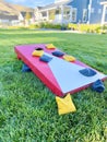 Cornhole board with bean bags on lawn Royalty Free Stock Photo