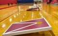 Cornhole game boards and bowling set up in a gym Royalty Free Stock Photo