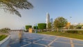 Corniche boulevard beach park along the coastline in Abu Dhabi timelapse hyperlapse with skyscrapers on background. Royalty Free Stock Photo