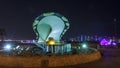 A fountain featuring an oyster with a gigantic pearl inside night timelapse with the Doha skyline behind it Royalty Free Stock Photo