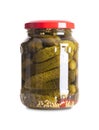 Cornichons, small crunchy pickles, pickled gherkins in a glass jar Royalty Free Stock Photo
